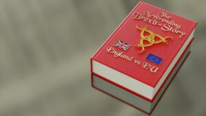 Unscharfer Hintergrund, im Vordergrund ist ein rotes Buch auf dem "A Neverending Story Brexit vs EU" steht